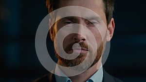 Business portrait serious Caucasian man adult male posing in evening office looking at camera close-up headshot sad face