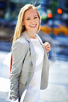 Business, portrait and smile with urban, walk and commute for work or career. Woman, job and new york street with city