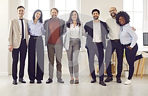 Business portrait, successful group of businesspeople in modern office looking at camera