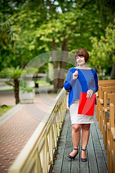 Business portrait of a woman who works as an accountant, economist with documents and a calculator