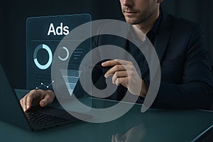 Business professional analyzing advertising campaign performance on futuristic interface with laptop showing data visualization