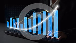 Business professional analyzing digital graphs and data trends on a virtual touchscreen device in a modern office