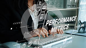 Business Professional Analyzing Performance Metrics and Data Insights on Digital Interface in Modern Office Setting