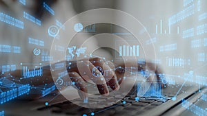 Business professional using laptop with digital interface featuring graphs, data visualization, and statistics for