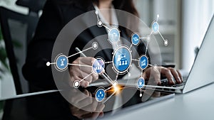 Business Professional Engaging in Digital Networking and Data Analysis with Laptop and Interactive Interface Elements in