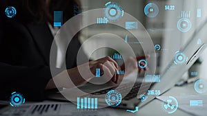 Business professional engaging with innovative digital technology on laptop with data graphs and analytics in modern