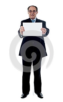 Business professional holding blank billboard