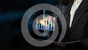 Business Professional Interacting with Digital Data Visualization on Tablet Displaying Charts and Graphs of Growth