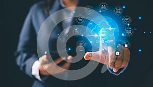 Business professional interacting, glowing cloud computing interface surrounded by technology icons representing data storage,