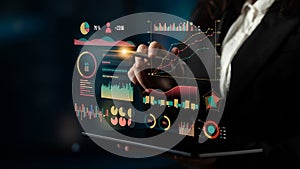 Business professional interacts with futuristic digital analytics dashboard, showcasing data visualization with graphs