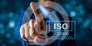 A business professional interacts with a transparent digital checklist for the stringent ISO 22000 food safety management