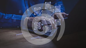 Business professional typing on laptop with glowing handshake icons, analytics, teamwork and digital communication