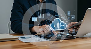 Business professional using digital tablet with cloud computing interface