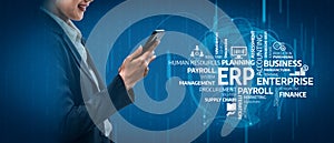 Business professional using smartphone for enterprise resource planning and digital management in modern corporate