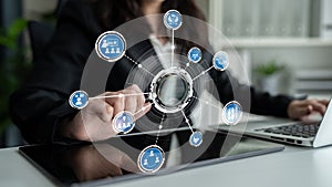 Business Professional Using Technology for Data Analysis and Management in a Modern Office Setting with Digital