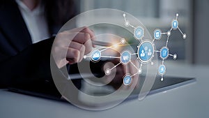 Business Professional Using Touchscreen Tablet with Digital Icons Representing Technology, Data, and Communication in