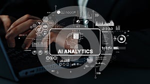 Business professional working on laptop with AI analytics concept and data visualization on screen for technology and