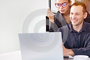 Business professionals. Group of young confident business people analyzing data using computer while spending time in office