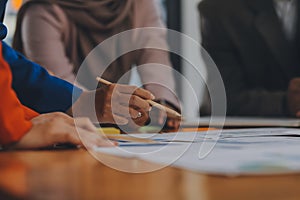 Business professionals. Group of young confident business people analyzing data using computer while spending time in the office