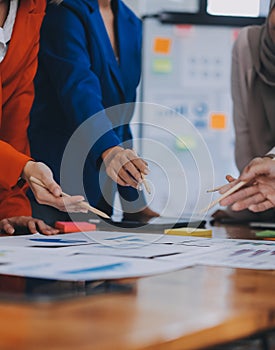 Business professionals. Group of young confident business people analyzing data using computer while spending time in the office