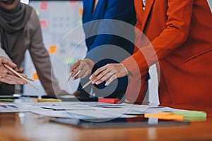 Business professionals. Group of young confident business people analyzing data using computer while spending time in the office
