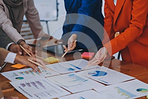 Business professionals. Group of young confident business people analyzing data using computer while spending time in the office