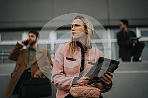 Business professionals on the move outside a modern office building