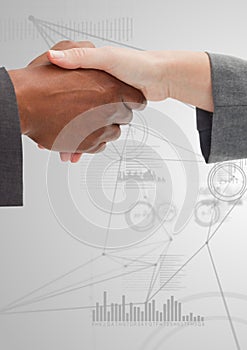 Business professionals shaking hands against technology Background