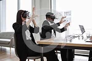 Business professionals using virtual reality technology in modern office