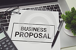 Business Proposal on white paper.