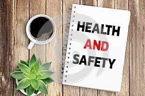 Business quotes, HEALTH AND SAFETY on notebook or paper in office desk, office workplace