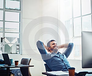 Business, relax and happy man at desk for stretching, productivity or done with project in office. Smile, computer and