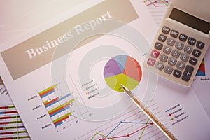 Business report chart preparing graphs calculator concept Summary report in Statistics circle Pie chart on paper business document