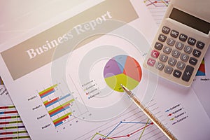 Business report chart preparing graphs calculator concept Summary report in Statistics circle Pie chart on paper business document photo