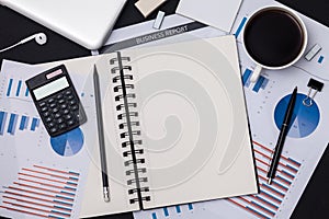 Business reports and cup of coffee.