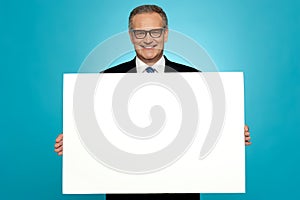 Business representative holding blank ad board