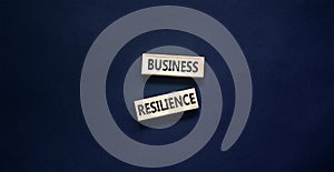 Business resilience symbol. Concept word Business resilience typed on wooden blocks. Beautiful black table black background.