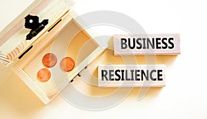 Business resilience symbol. Concept word Business resilience typed on wooden blocks. Beautiful white table white background.