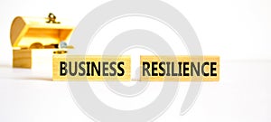 Business resilience symbol. Concept word Business resilience typed on wooden blocks. Beautiful white table white background.