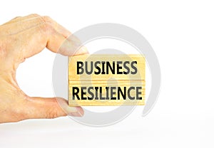 Business resilience symbol. Concept word Business resilience typed on wooden blocks. Beautiful white table white background.