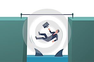 Business risk concept. A businessman will fall into the abyss with sharks