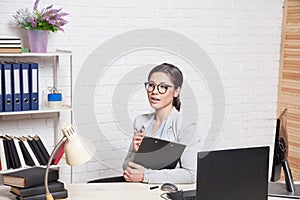 The business Secretary girl works at the computer
