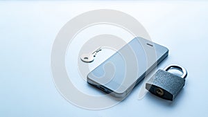Business security protection. Modern space grey mobile phone with padlock, key on white background. Smartphone fraud