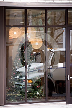 Business semi truck in reflection of Christmas window