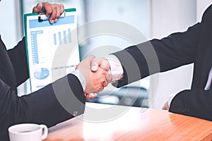 Business shaking hands. Business executives to congratulate the joint