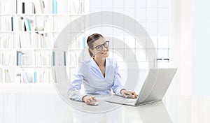 Business smiling woman or a clerk working at her office desk wit photo