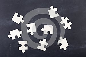 Business solution concept jigsaw on the blackboard