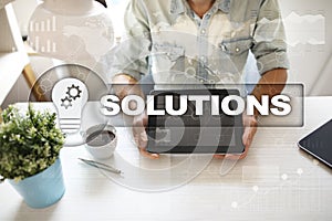 Business solutions concept on the virtual screen.
