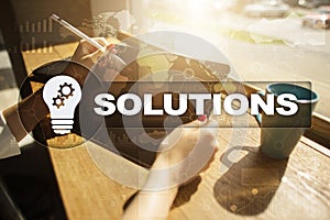 Business solutions concept on the virtual screen.