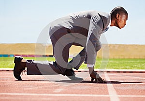 Business, start and black man with focus, race track and competition with determination, run and goal. Male person
